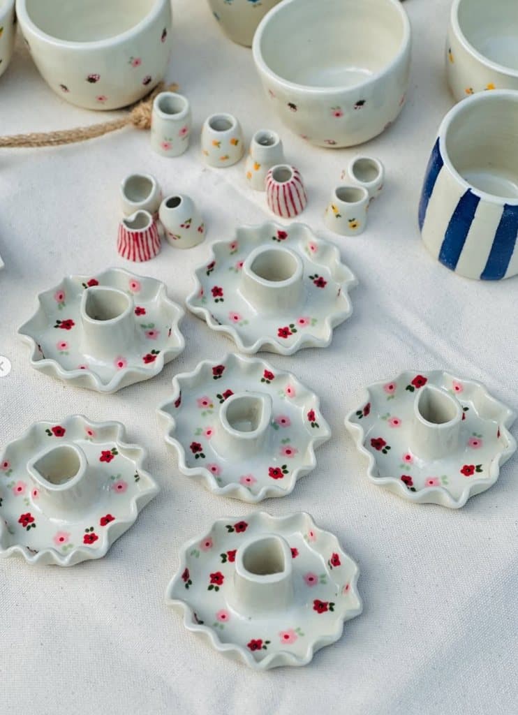 Spread of ruffled ceramic candle holders and mini bud vases